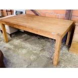 Oak laminate table on block supports.