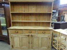 Large antique pine dresser with two shelves and three frieze drawers over 2 cupboards.