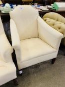 Upholstered armchair requiring loose cover.