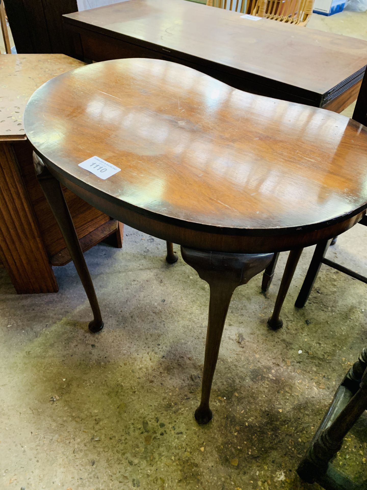 Mahogany kidney shaped occasional table.