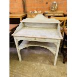 Painted washstand with top shelf, frieze drawer and shelf below.