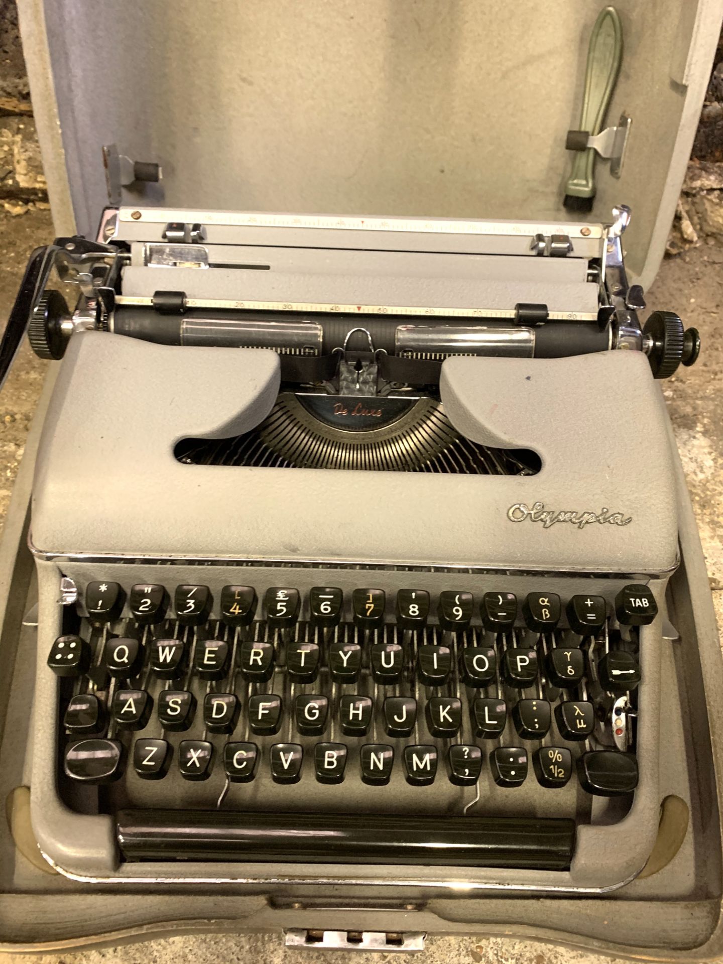 Olympia SM3 portable typewriter in hard case.