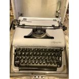 Olympia SM3 portable typewriter in hard case.