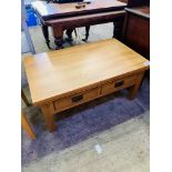 Oak low table with two double-sided frieze drawers, with slatted sides.