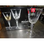 6 Melodia Crystal goblets. This item carries VAT.