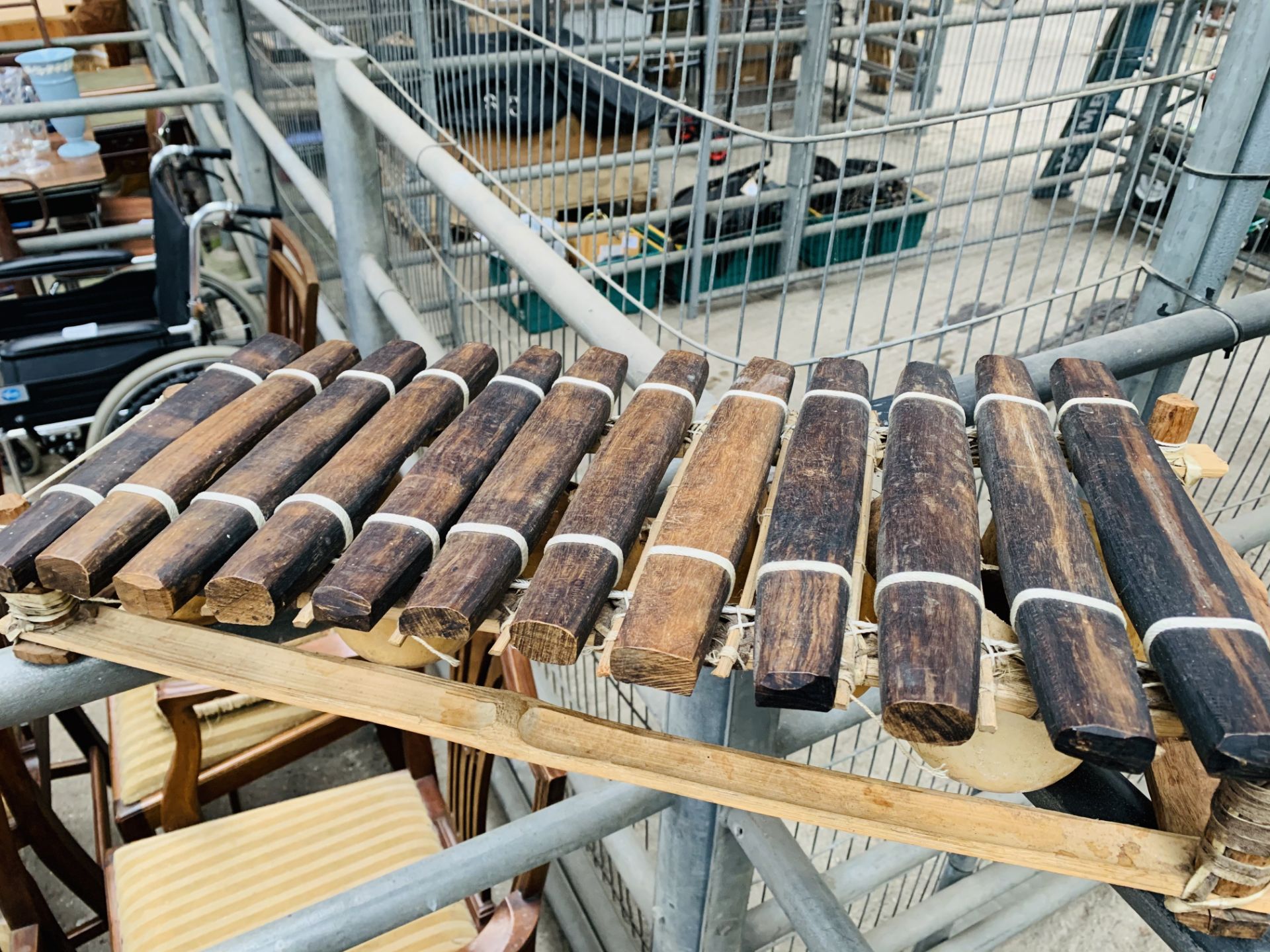 Two brass table lamps, a xylophone, and a folder of pictures of skulls. - Image 4 of 4