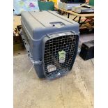 Large pet transport cage.