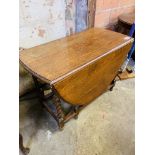 Oak dropside gate leg table with barley twist legs.