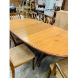 Oval extending G-Plan dining table together with 4 chairs and 2 carvers.