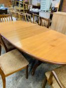 Oval extending G-Plan dining table together with 4 chairs and 2 carvers.