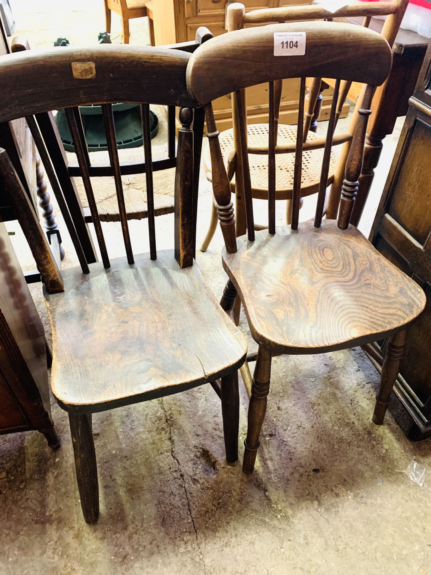 Two elm seat comb back kitchen chairs.