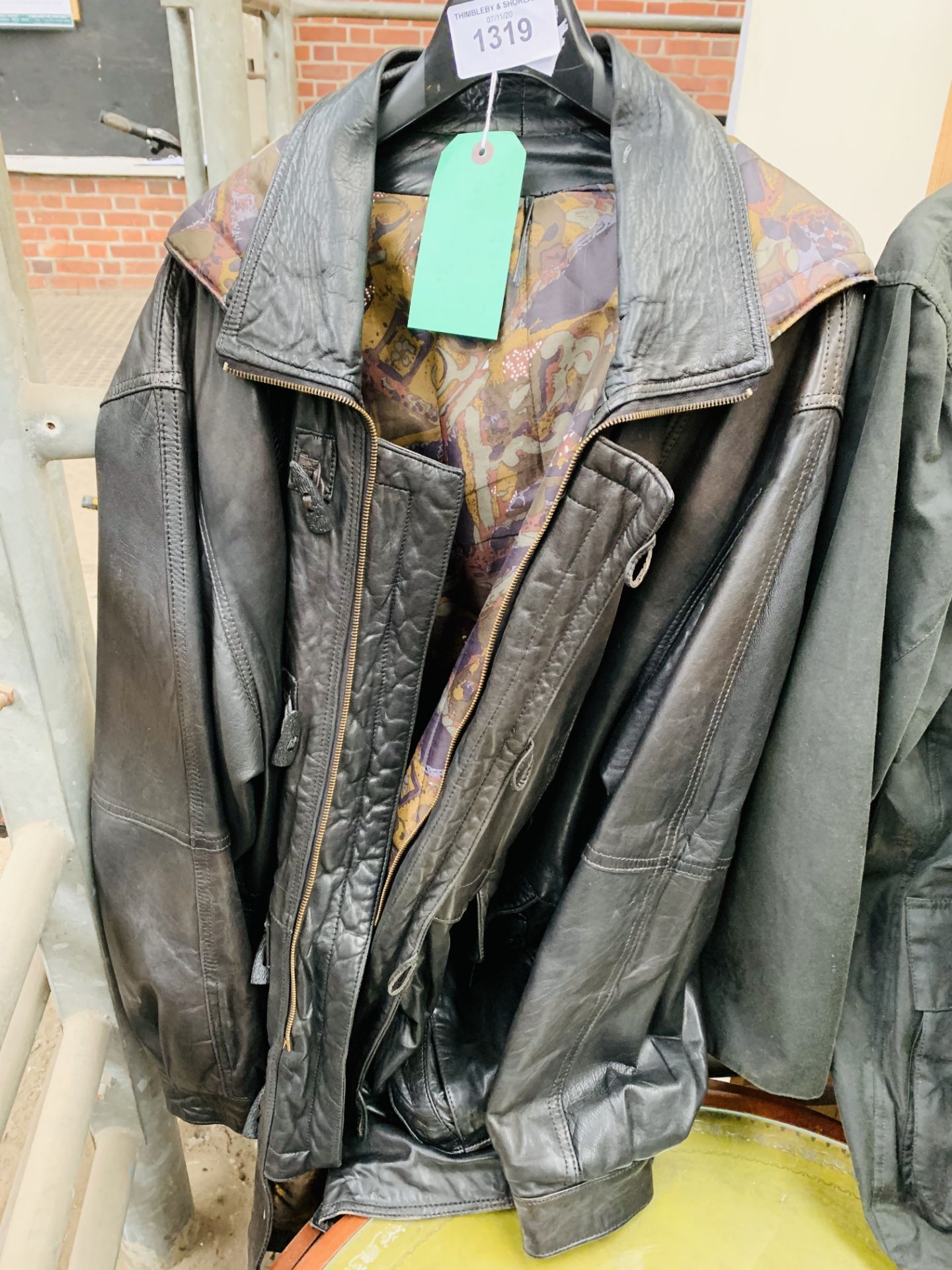 Black leather jacket 3/4 length.