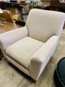 Oatmeal upholstered armchair.