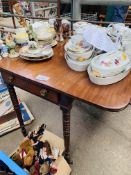 Mahogany drop leaf table on turned legs with side frieze drawer.