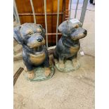 Two painted concrete Rottweiler puppies figures, 47cms height.