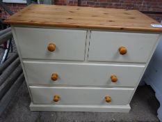 Cream painted pine chest of two over two drawers.