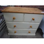 Cream painted pine chest of two over two drawers.