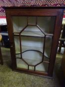 Mahogany glass fronted cabinet, with a shaped shelf and another, with key