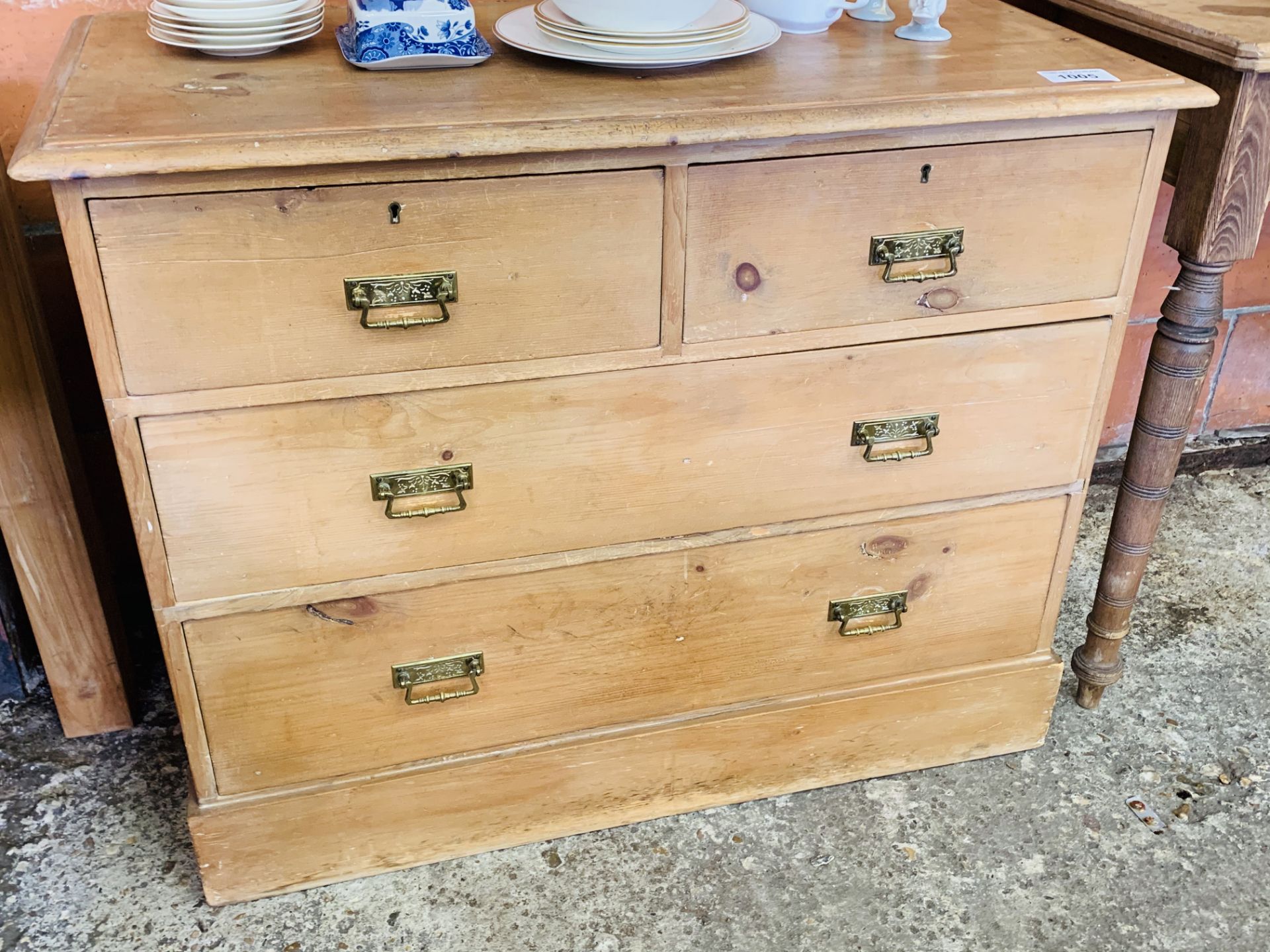 Antique pine chest two over two drawers with brass handles.