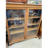 Mahogany bow fronted book case with three shelves, glass fronted doors, key