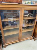 Mahogany bow fronted book case with three shelves, glass fronted doors, key