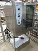 Rational combi master 10 grid combi oven III phase on stand.