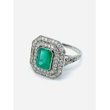 Platinum, emerald and diamond ring.