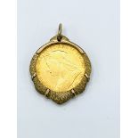 1900 gold half sovereign in 9ct gold pendant surround.