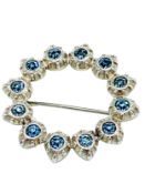 Early 20th century costume brooch, of blue paste stones in circular piecrust setting.