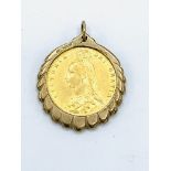 1887 gold half sovereign in 9ct gold pendant surround.