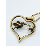 9k gold, diamond and ruby Hummingbird pendant and chain.