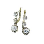 18ct gold three diamond drop earrings.