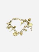 9ct gold charm bracelet with 11 charms.