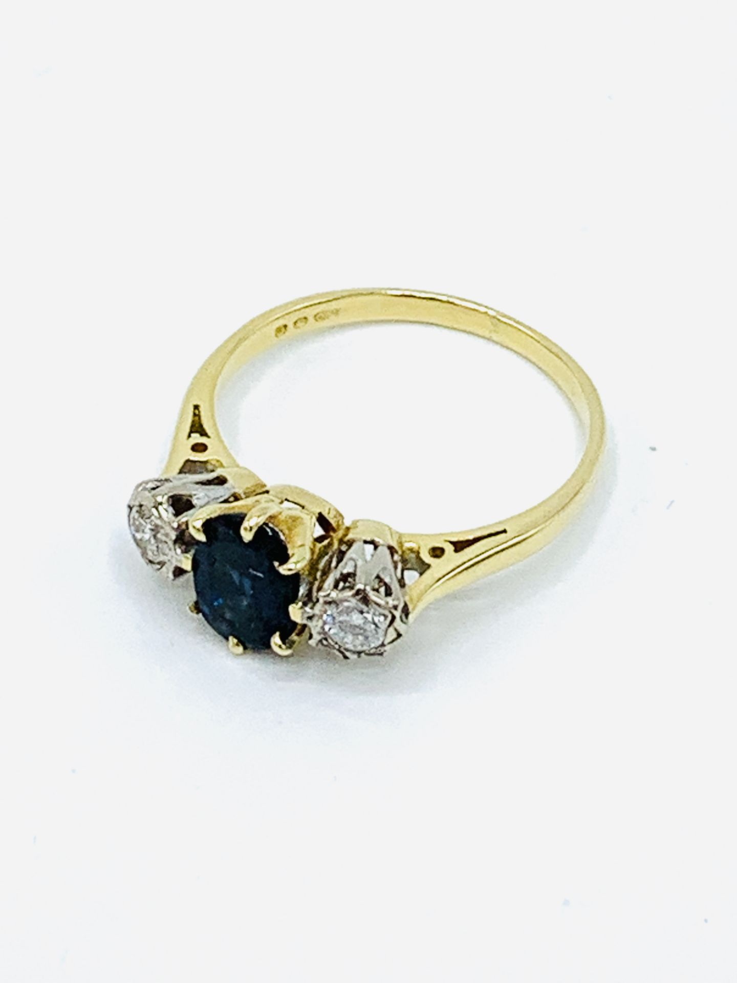 18 k gold, sapphire and diamond trilogy ring.