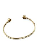 Child’s 9ct gold torque bangle with single CZ at each finial.