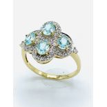 18ct gold aquamarine and diamond dress ring.
