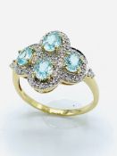 18ct gold aquamarine and diamond dress ring.