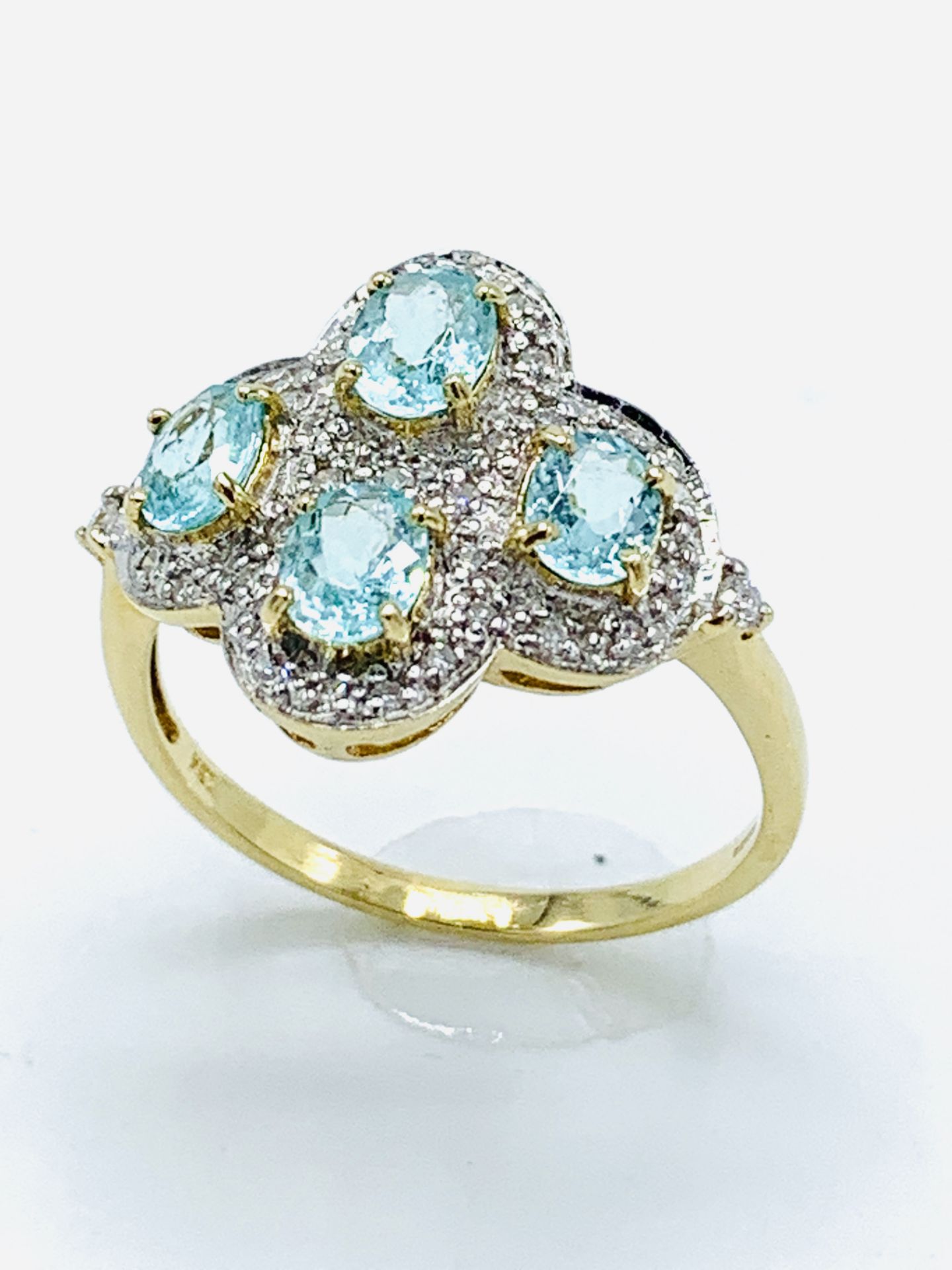 18ct gold aquamarine and diamond dress ring.