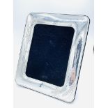 Large unglazed sterling silver picture frame.