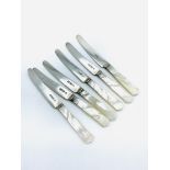 Set of 6 fruit knives with hallmarked silver blades and mother of pearl handles.