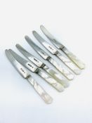 Set of 6 fruit knives with hallmarked silver blades and mother of pearl handles.