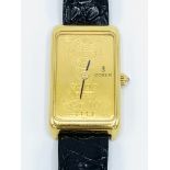 18ct gold cased Corum watch.