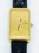 18ct gold cased Corum watch.