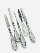 Four hallmarked silver handled manicure set and one other.