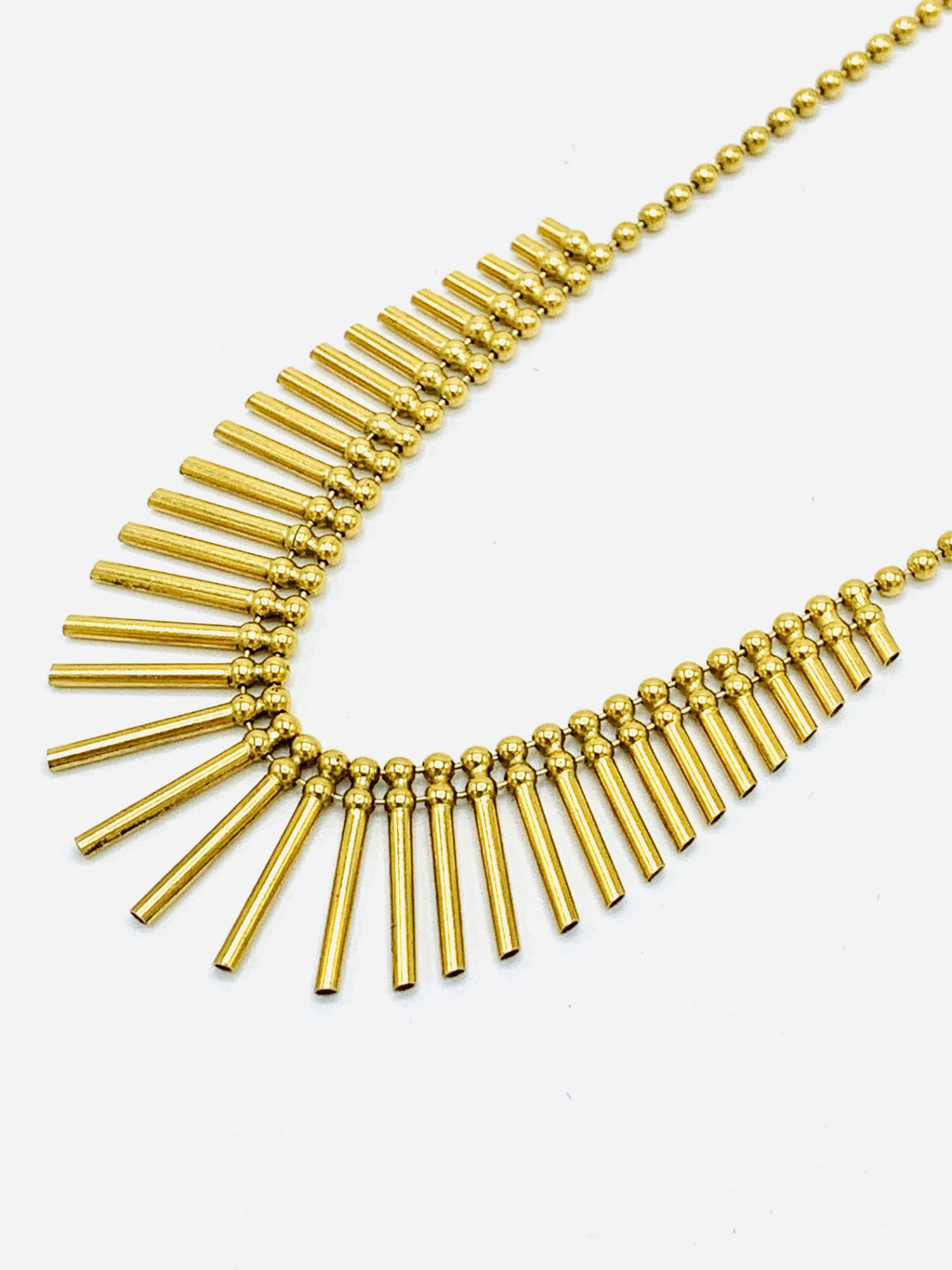 750 gold pin necklace.