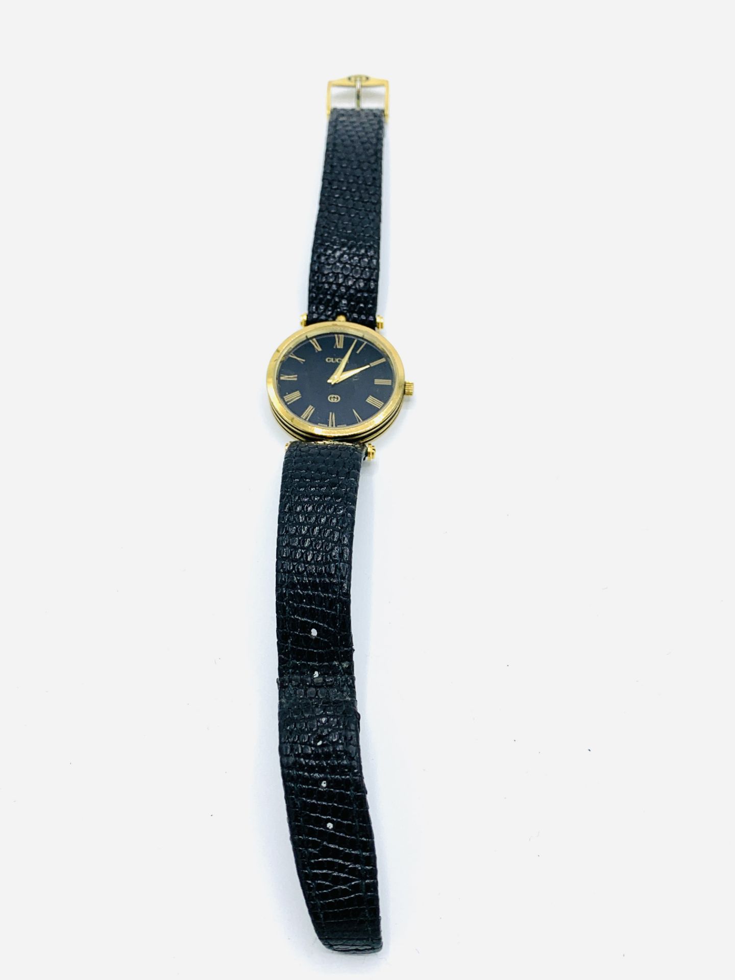 Gucci gold plated and black wrist watch with original strap. - Image 2 of 3