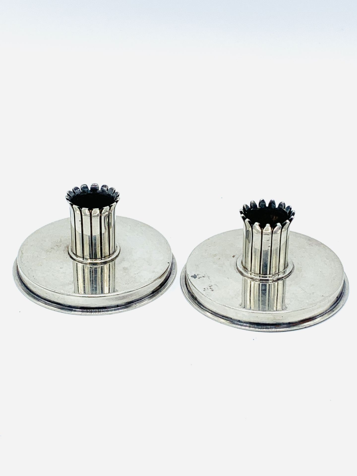 Pair of Georg Jensen sterling silver candlesticks.