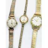 18ct gold cased Zenith lady's wristwatch; a 9ct gold Tissot wristwatch; and another.