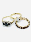 Three 9ct gold and precious stone rings