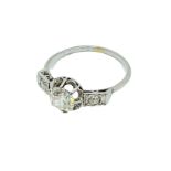 18ct white gold diamond ring with diamonds to shoulders.